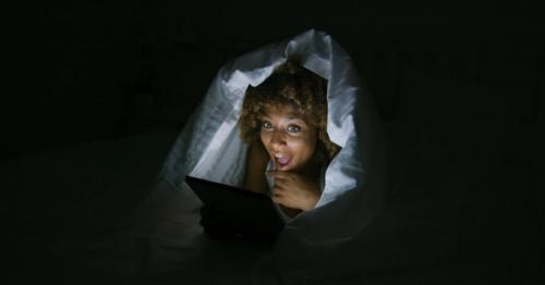 Excited Woman Under Blanket with Tablet - 7BEAQC9