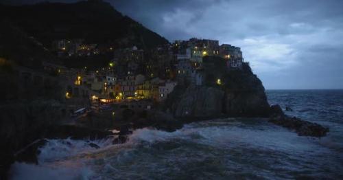 Romantic view of evening Manarola village with illuminated houses, landscape - T9J7XZD