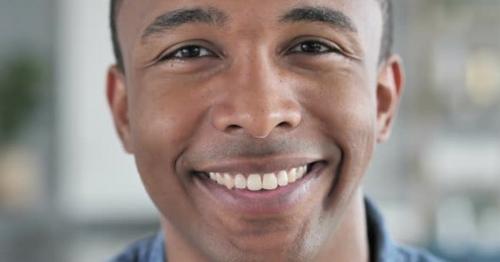 Smiling Face of Young African Man Looking at Camera - 4LB69SW