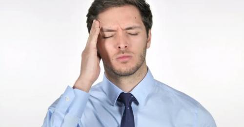 Stressed Young Businessman with Headache on White Background - DNYPJS2