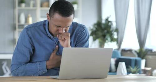 Sick Young African Man Coughing at Work, Cough - Y9LWEQA