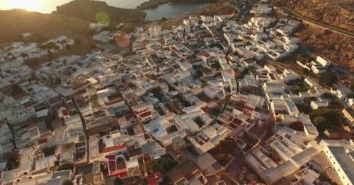 Birds Eye View of Houses in Lindos, Rhodes and a Road on the Side - JNXM46W