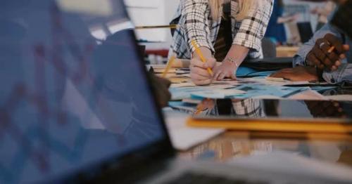 Close-up View of Multiethnic Team Working Together Behind Office Table, Woman Speaking Is Seen in - UENCHVL