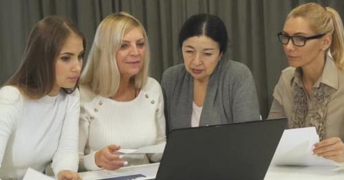 Group of Business Women Having a Meeting at the Boardroom - L8ZYXVK