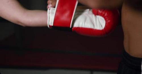 Coach Helps Women Boxer To Put On Gloves 17 - EBSM4L5