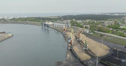 Empty Harbor With the Cranes and Stored Bulk Cargo Waiting For Ships to Arrive - JU7NZVH