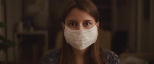 Videohive - Portrait of A Young Woman Putting on A Protective Mask, Close Up