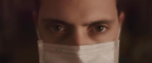 Videohive - Extreme Close up Of a Young Man Opening His Eyes While Wearing a Protective Mask
