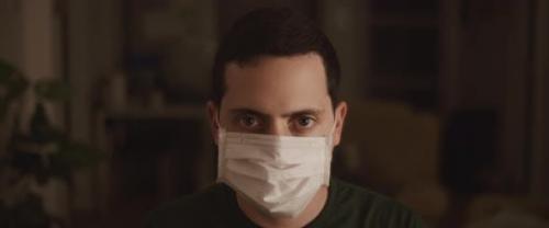Videohive - Portrait of A Young Man Putting on A Protective Mask, Close Up
