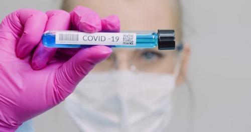 Videohive - Researcher Holding Covid-19 Sample Tube in Hand