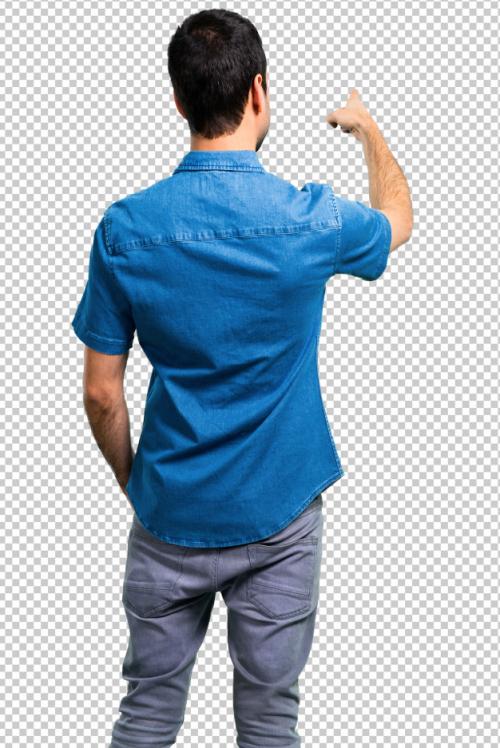 Handsome Man With Blue Shirt Pointing Back With The Index Finger Premium PSD