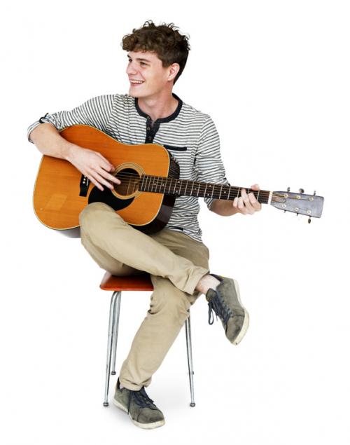 Young Adult Man Sitting Playing Guitar Studio Portrait Premium PSD