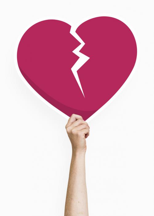 Hand Holding A Broken Heart Cardboard Prop Premium PSD