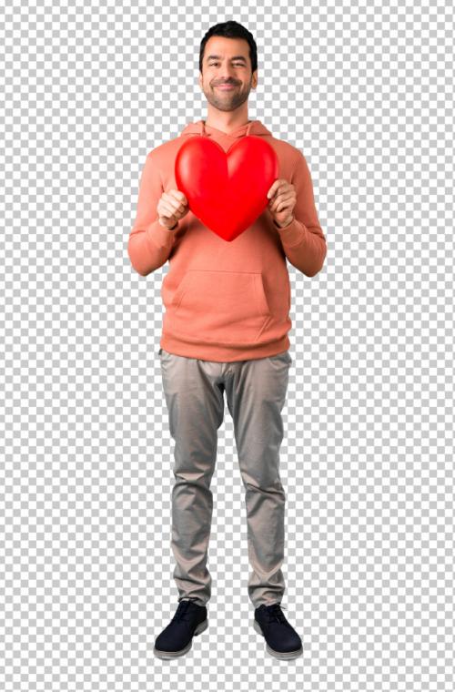 Man In A Pink Sweatshirt Holding A Big Heart Icon Toy Premium PSD