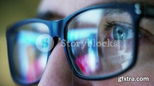 Videoblocks - Close up of young businessman with blue eyes wearing the glasses looking on the waveform lines expressed concept of stock market, growth stock market, economic profits, stock exchange | Footages