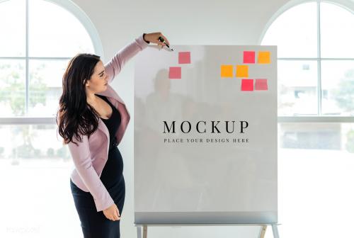 Businesswoman writing on a whiteboard mockup - 2203489