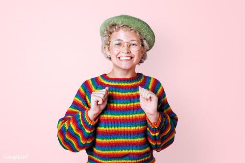 Happy lesbian woman with rainbow sweater on a pink wall mockup - 2227133