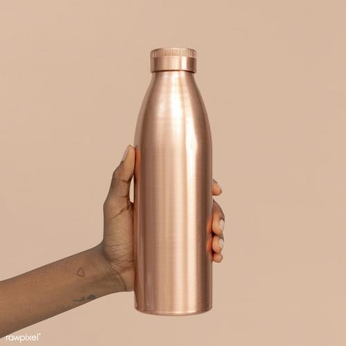 Hand holding a copper stainless steel bottle mockup - 2277092