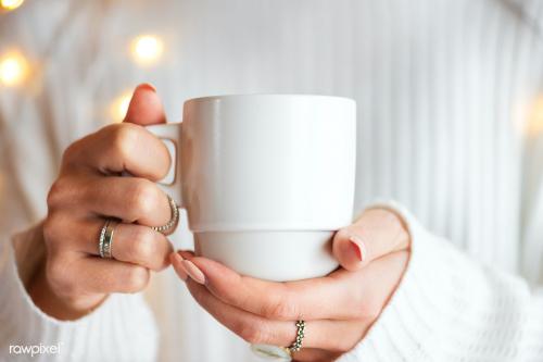 Woman in a white sweater with a white cup mockup - 1231715