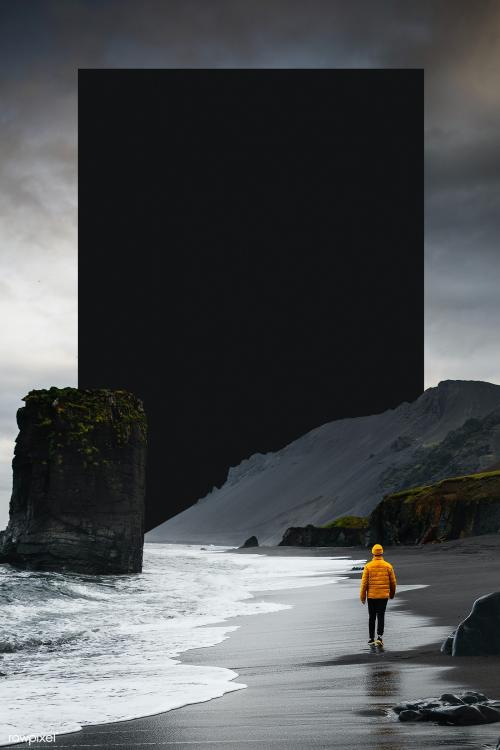 Man walking along a black beach in Iceland template - 1234736