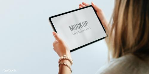 Woman holding a digital tablet mockup - 2027099