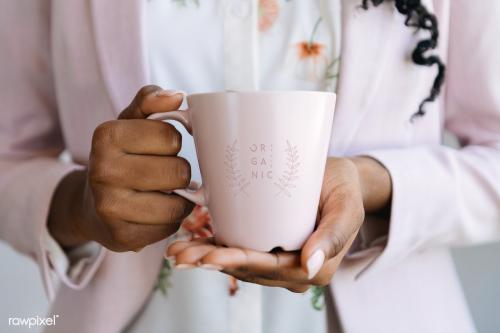 Woman holding a pink mug mockup illustration - 2030344