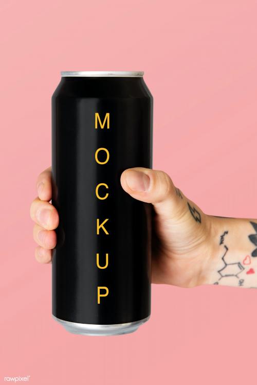 Hand holding a black aluminum can psd mockup - 2051930