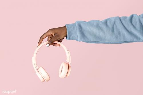 Hand holding a pink headphones mockup - 2053165