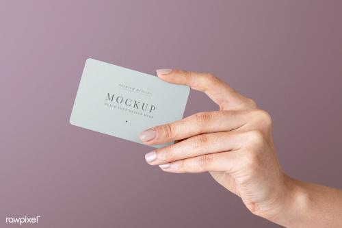 Hand holding a card psd mockup - 2054361