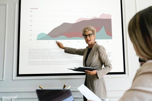 Blonde aged woman having a presentation mockup - 1216560