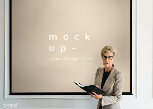 Blonde aged woman having a presentation mockup - 1216663