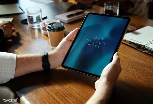 Business man holding digital tablet mockup - 1217918