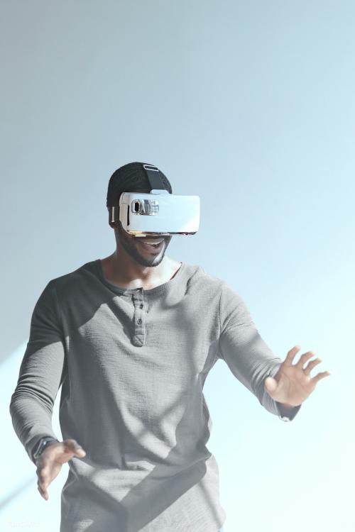 Black man experiencing virtual reality with VR headset - 1219011