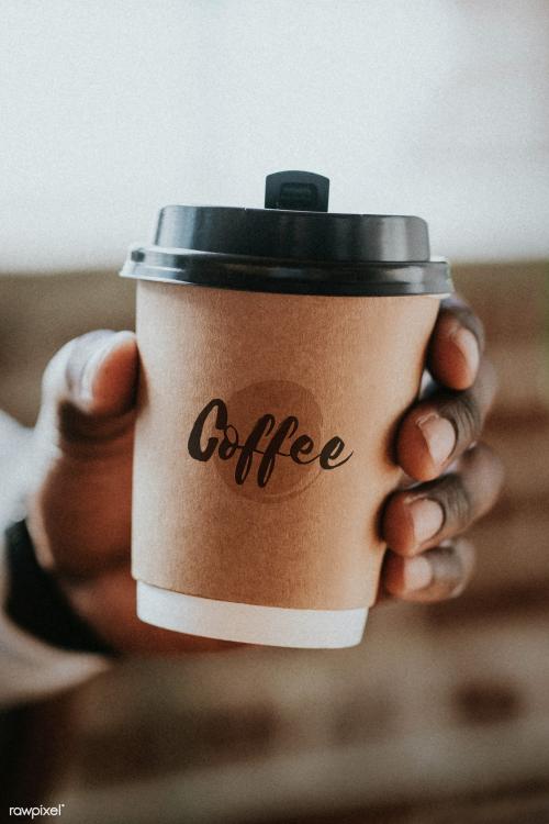 Man holding a takeaway coffee cup - 1219062