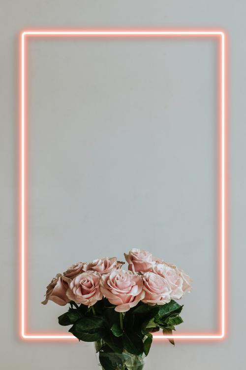 Beautiful pink roses in a vase on a table - 1221511