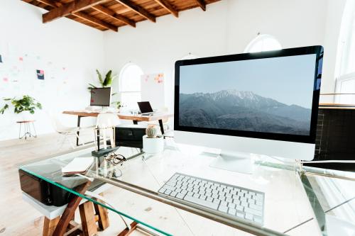 Computer on a glass table mockup - 1225001