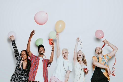 A group of diverse friends celebrating at a party - 1225239