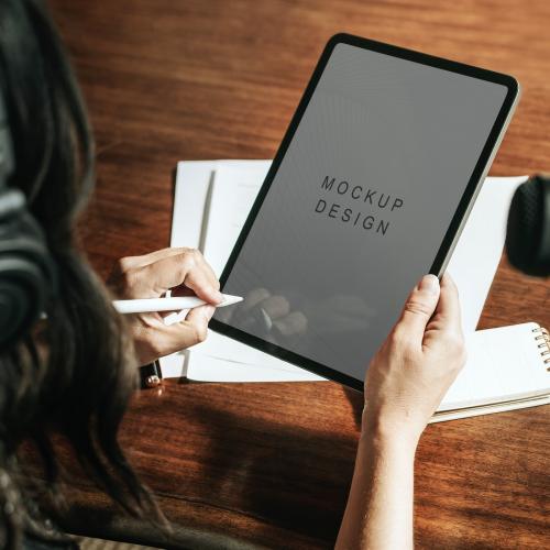 Woman writing on a digital tablet mockup mobile phone wallpaper - 1225617