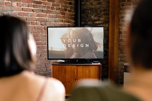 Couple watching a movie on a tv screen mockup - 1227029