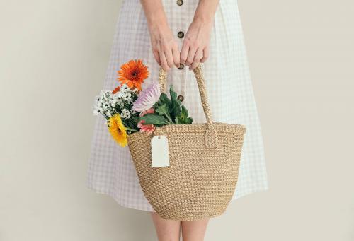 Girl carrying a bouquet in her bag - 1207367