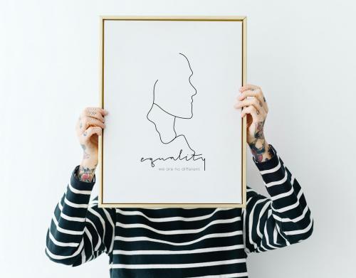 Tattooed woman holding a photo frame mockup - 1215146