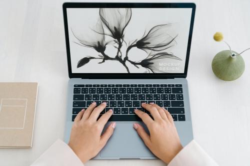 Woman using a laptop mockup - 1215308