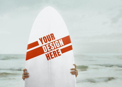 Surfer holding a surfboard mockup - 1079972