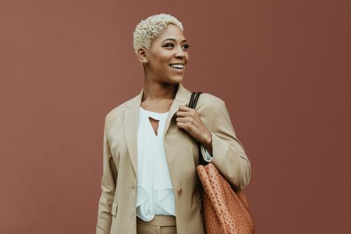 Happy black businesswoman strolling the streets - 1199613