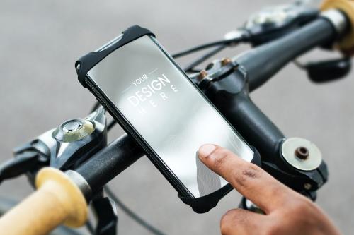 Cyclist using a phone on a bike - 844053