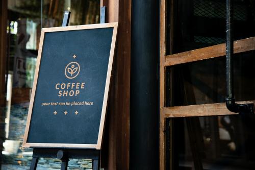 Blackboard sign mockup in front of a restaurant - 844151