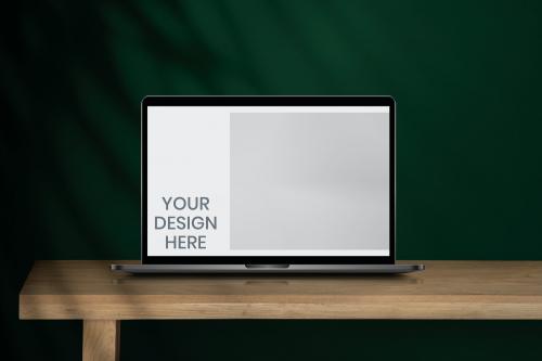Laptop screen mockup on a wooden table - 894273