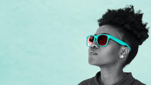 Black woman wearing teal sunglasses - 894454