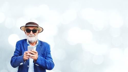 Elderly man using a mobile phone - 894496