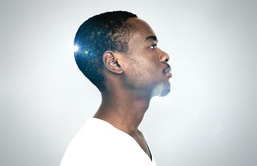 Side view of a thoughtful black man - 894536